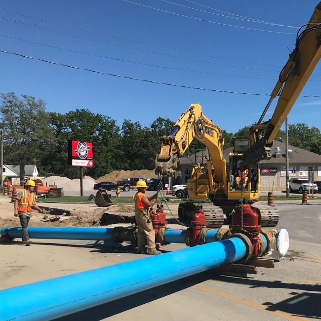 Installing pipe on street level